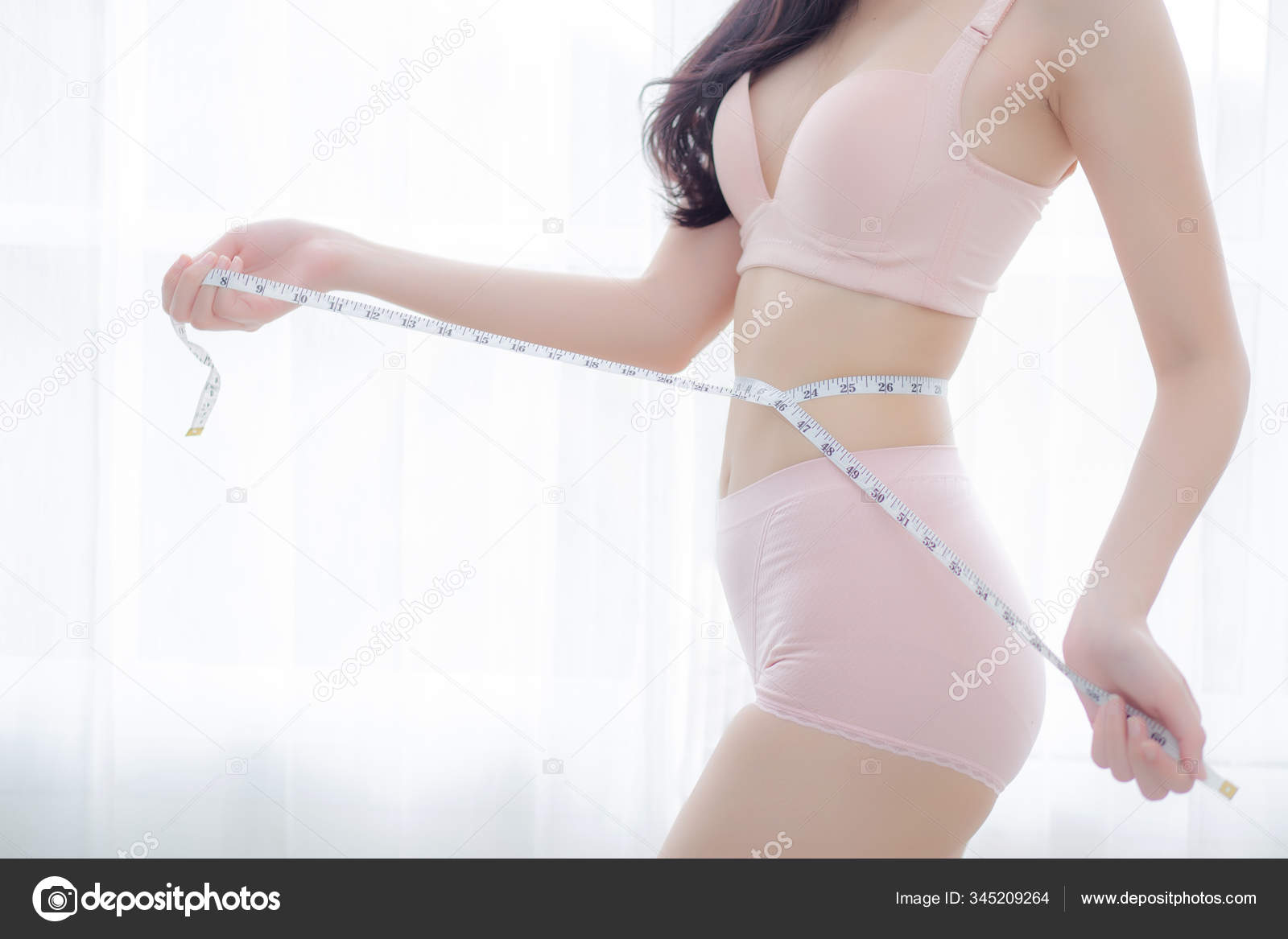 Beautiful young asian woman sexy body slim measuring abdomen for Stock  Photo by ©nnudoo 345209264