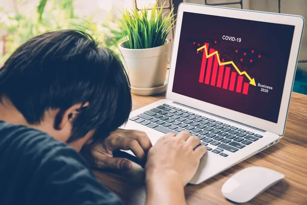 Businessman panic about financial of business with graph chart and diagram, disease covid-19 impact crisis economic with frustrated and stress, failure and problem of economy with fall down.