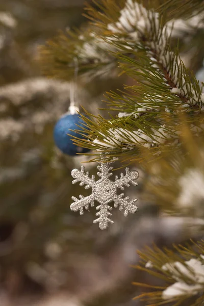 the first snow and the spirit of Christmas. Christmas decorations on Christmas tree