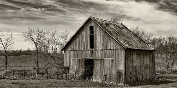 An aging barn in rural America in black and white.