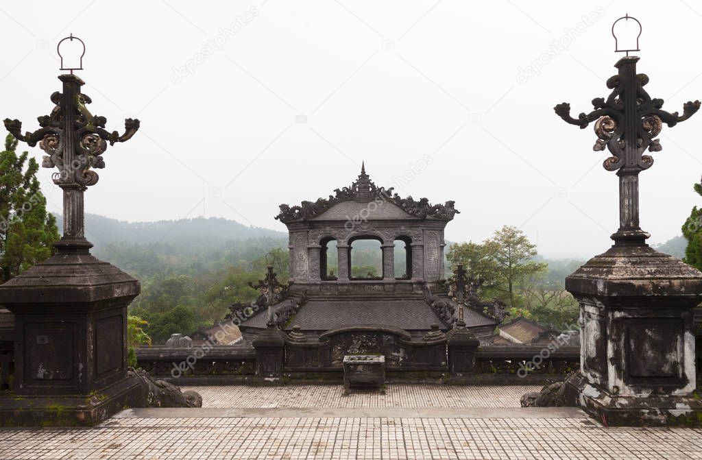 Hue, Vietnam. View from upper platform to the landscape and top of Stele House at the Royal Khai Dinh Tomb complex. 