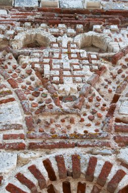 Nesebar, Bulgaria, July 23, 2012. Old Town of Nesebar. Church of St. Paraskeva, XIII century. Stone facade of the church. Ceramic facade inserts. Typical brick and stone masonry, authentic patterns. 