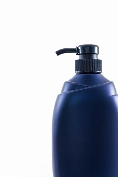 Dark blue bottle on a white background. — Stock Photo, Image