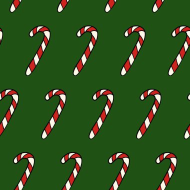 Yeşil arka planda Noel kırmızı ve beyaz şeker kamışı. Geometrik sonsuz şeker dokusu.