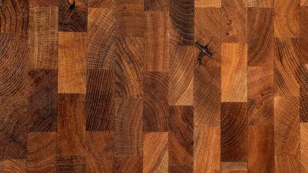 Yapıştırılmış ahşap parçalarından kesme tahtasının arka planı.