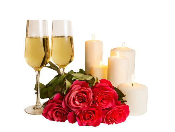 Champagne, rozen en kaarsen geïsoleerd op witte achtergrond — Stockfoto