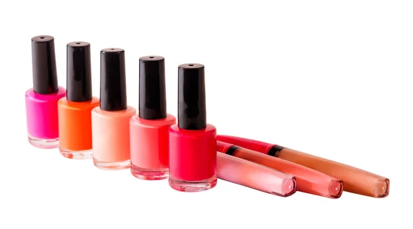 Groep van nagel poetsmiddelen en lip glossen geïsoleerd op wit — Stockfoto