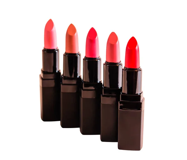 Set of beautiful lipsticks isolated on white background. Selective focus on red lipstick — Stock Photo, Image