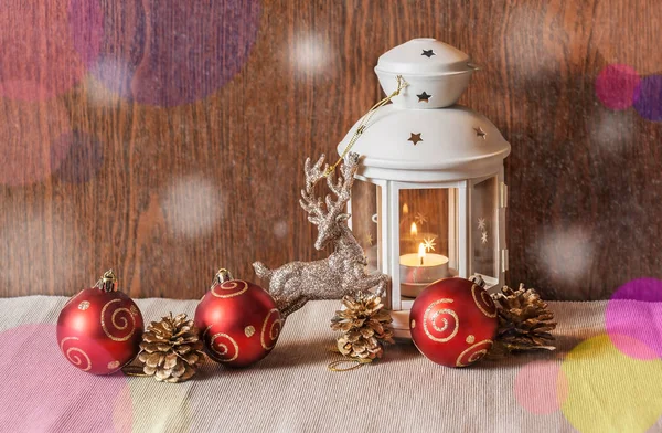 Christmas lantern and christmas decorations on wooden background — Stock Photo, Image