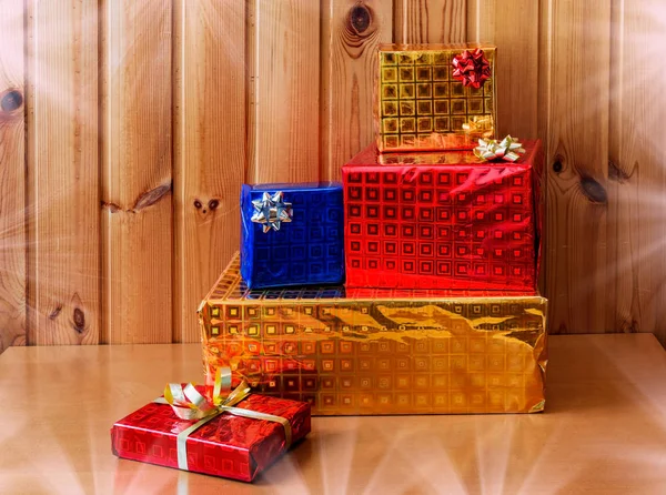 Presents  on wooden background — Stock Photo, Image