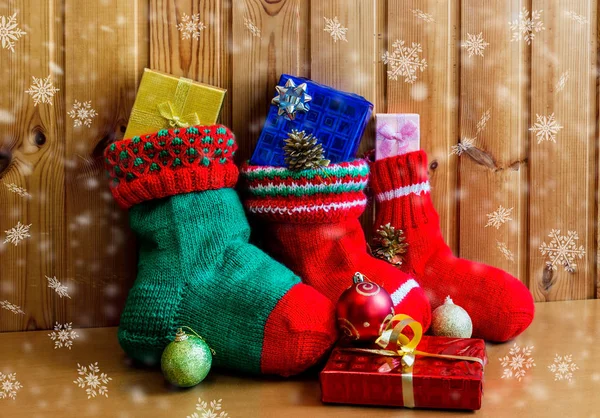 Christmas stockings on wooden background — Stock Photo, Image