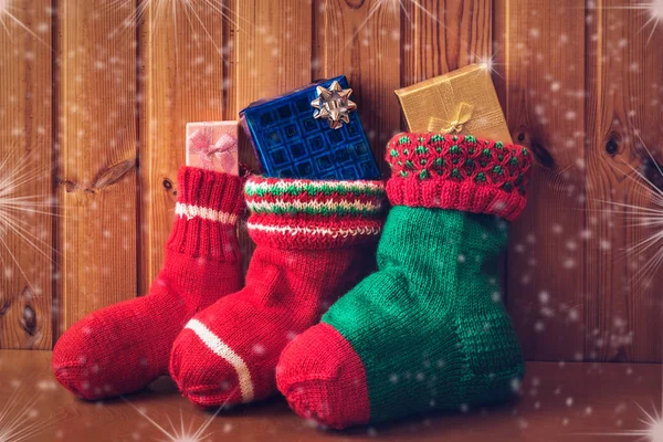 Christmas stocking on wooden background. Vintage style — Stock Photo, Image