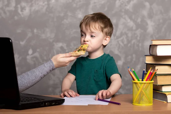Small Child Sits Home Table Books Laptop Eats Slice Pizza — Stock Photo, Image