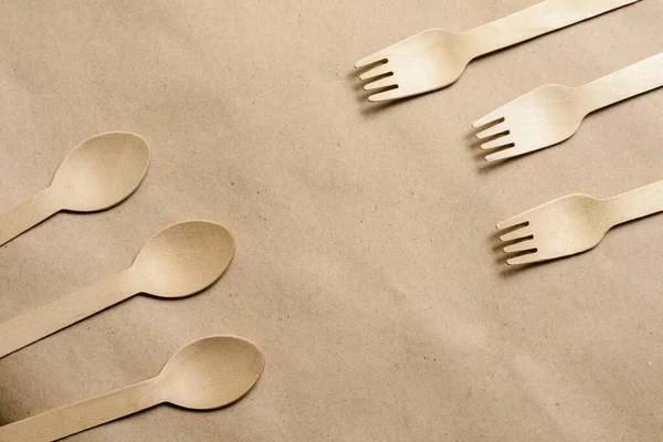 Disposable tableware from natural materials, wooden spoon, fork,  eco-friendly. Place for text