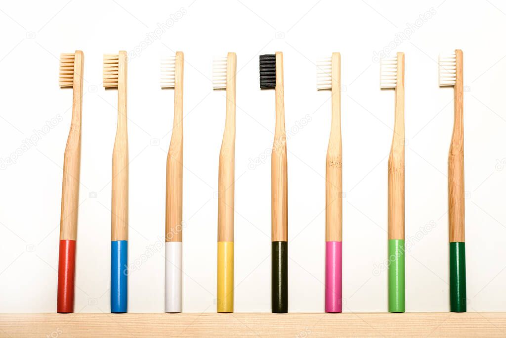 full colours bamboo toothbrushes on white background.Place for text. Ecoproduct.   eco-friendly.