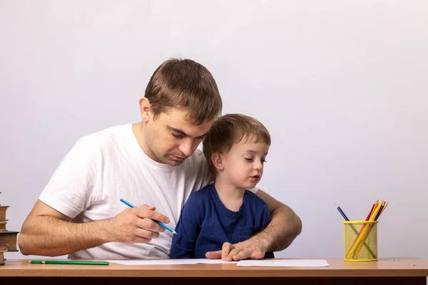 Little Boy Dad Sits Table Books Looks Pencils Gray Home — Stock Photo, Image