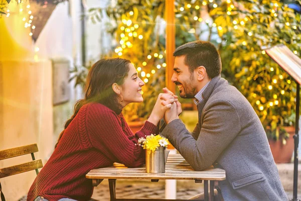 A romantic couple in goldish Christmas atmosphere — Stock Photo, Image