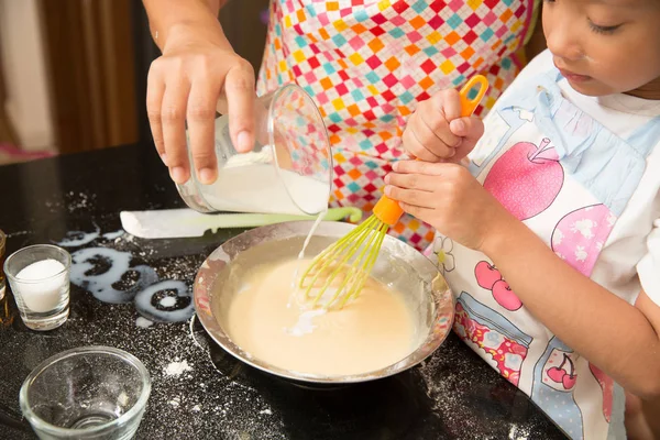 Asian family enjoy making pancake, Asian mother and daughter enj