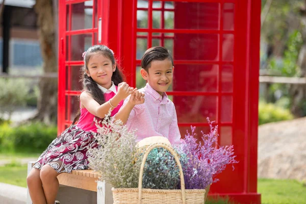 Little asian boy and girl enjoy playing in garden, Valentine or — Stock Photo, Image