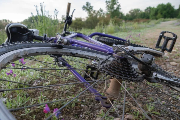 Perspective of old mountain bike lying on the ground