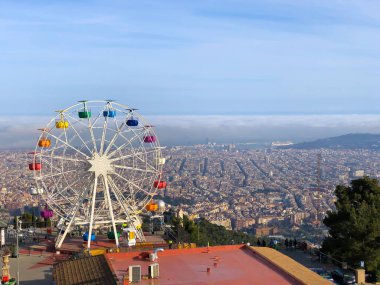 Beautiful view from the top of mountain Tibidabo, Barcelona. Traveling in Spain. Concept of tourism and leisure. clipart