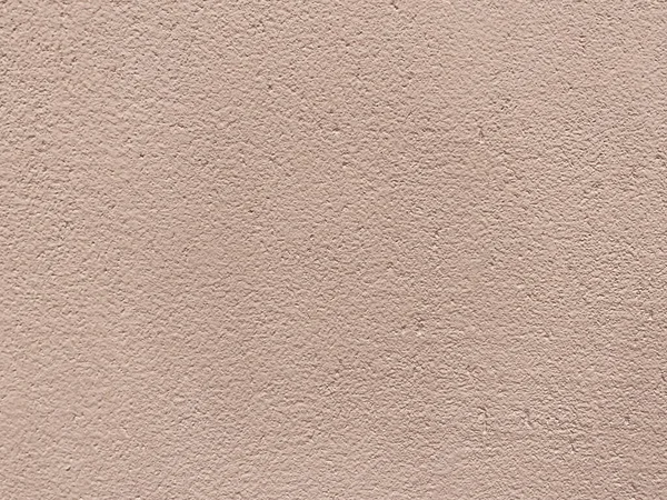 Close-up of the texture of the external stucco of a house. Construction and repair.