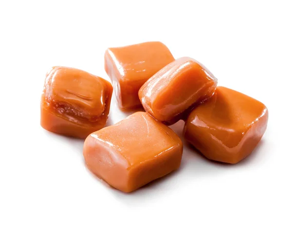 Slightly melted caramel candy close-up isolated on white background — Stock Photo, Image