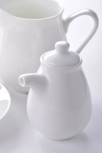 White porcelain sauceboat and creamer close-up — Stock Photo, Image