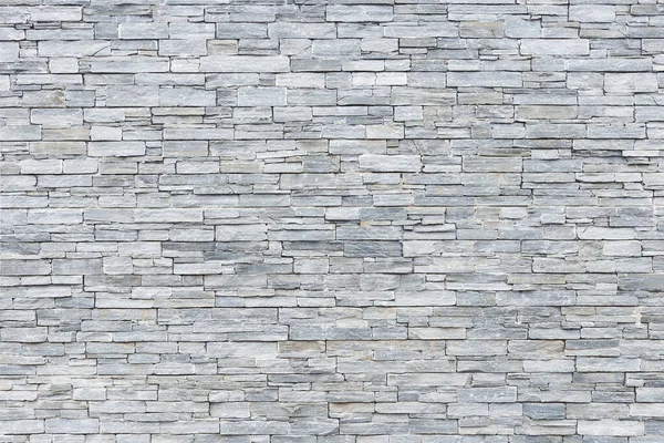 Limestone wall in small rectangular blocks for background — Stock fotografie