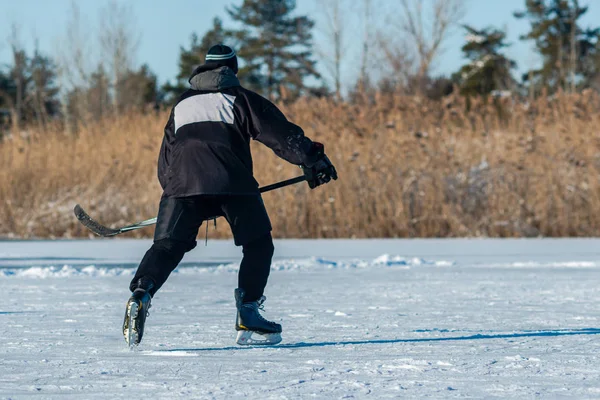 Playing ice street hockey on the frozen lake