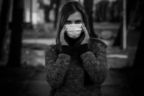 Woman in protective surgical mask. Corona Virus And Quarantine Concept.