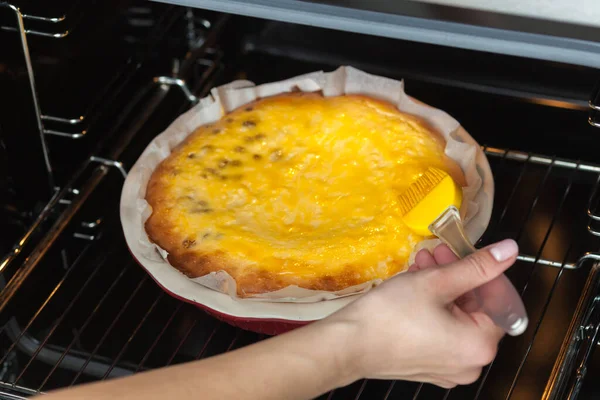 Oven baked cottage cheese casserole. In red baking dish.