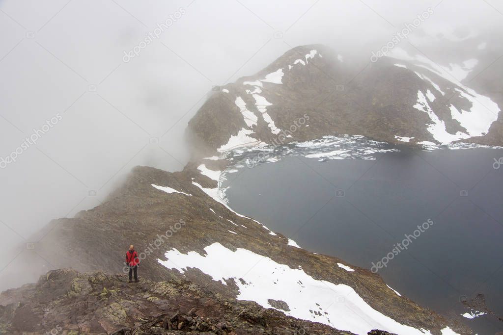 Hiking in in the mountains. Besseggen Ridge. Yotunheimen national park. Norway, Europe