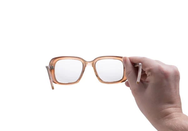 A férfi kezében szemüveg — Stock Fotó
