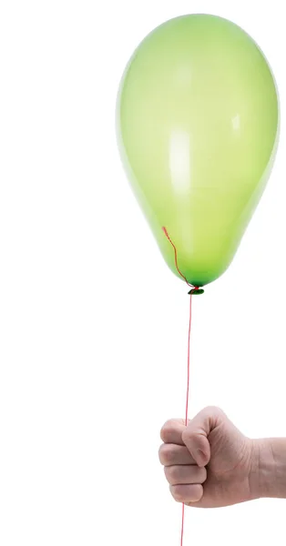 Grüner Luftballon in der Hand — Stockfoto