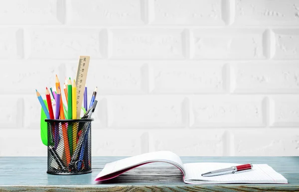 Book and pens on desk — Stock Photo, Image