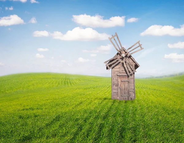 Windmill on green grass — Stock Photo, Image