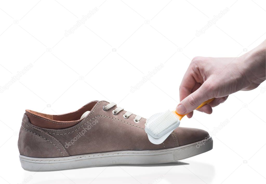 Man cleaning shoe