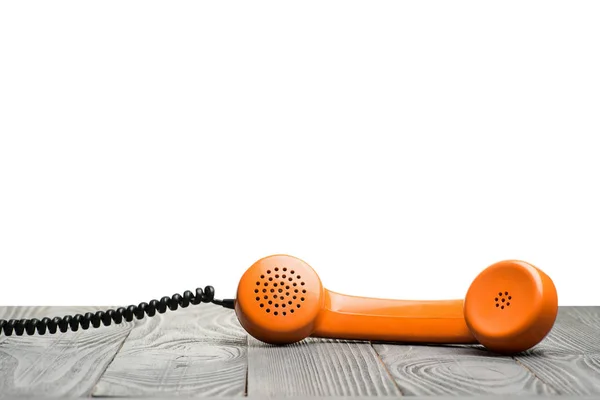 Otange Handset op een tafel — Stockfoto