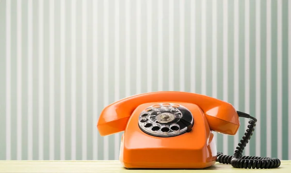 Retro phone on desk — Stock Photo, Image
