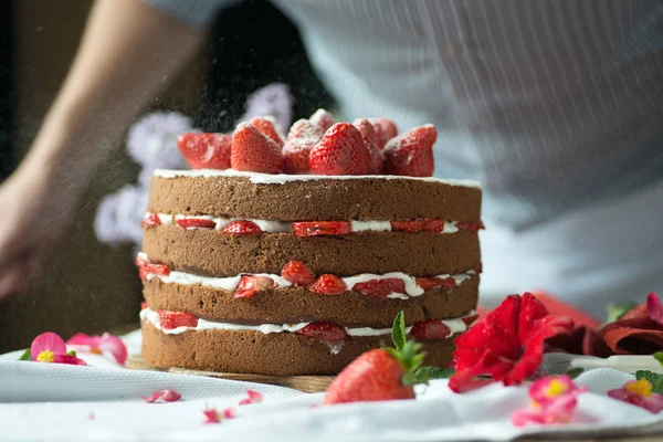 Cake with strawberries on the table