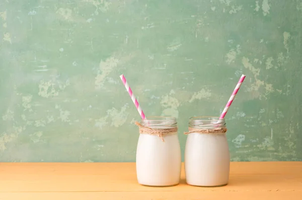 Milk bottles with a straws