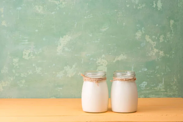 Milk bottles on table — Stock Photo, Image
