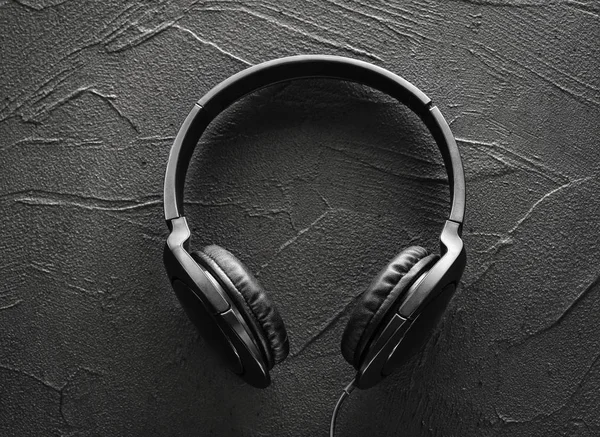 Earphones on Texture of  cement — Stock Photo, Image