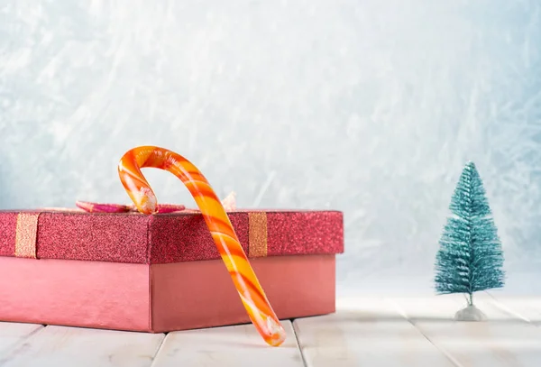 Gift box, candy and Christmas tree — Stock Photo, Image