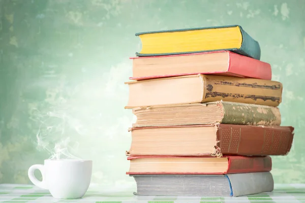 Coffee and books on table