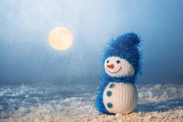 Snowman in the moonlight and lantern — Stock Photo, Image