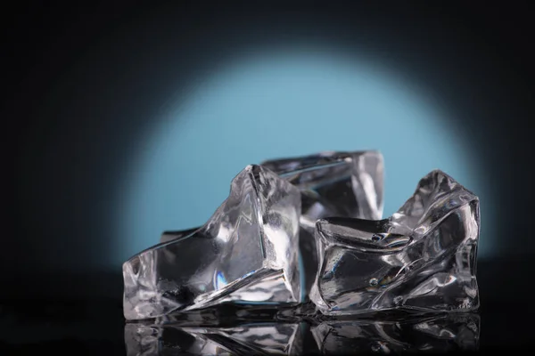 Ice cubes on blue — Stock Photo, Image
