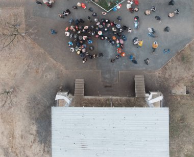 A meeting of people near the stage. Protest, rally, meeting.