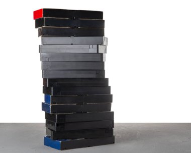 VHS videocassettes on a table with isolated background